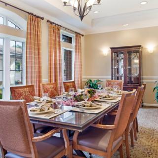 A beautifully set dining room with elegant furnishings and decor.