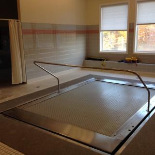 An indoor therapy pool used for rehabilitation and exercise.