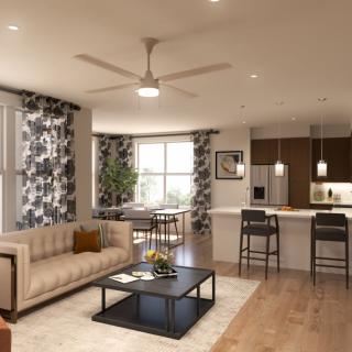 A modern open-concept living room and kitchen with stylish decor and hardwood floors.