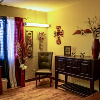 A cozy living room corner featuring elegant furniture and decorative elements.