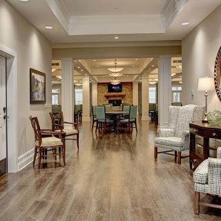 A spacious and elegantly decorated hallway leading into a cozy living area.
