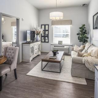 A modern living room with stylish decor and neutral color palette.