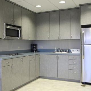 A modern kitchen with sleek cabinetry and stainless steel appliances.