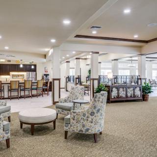 A modern and spacious lobby with comfortable seating and elegant interior design.