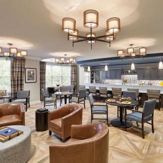 A modern lounge area with comfortable seating and elegant lighting.
