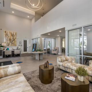 A modern lobby with stylish furniture and decor.