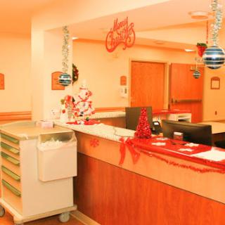 A festively decorated hospital reception area ready for the holiday season.