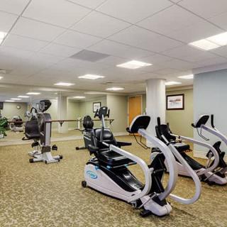 A well-equipped gym with exercise bikes and various fitness machines.