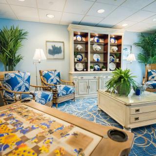 A cozy living room with elegant decor and a blue color scheme.