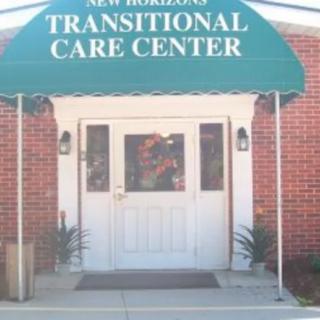 Entrance of a transitional care center with a green awning.