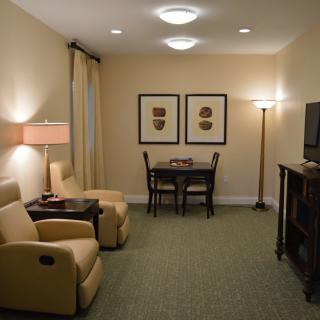 A cozy living room with comfortable seating and modern decor.