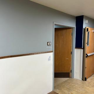 A view of a hallway featuring a door labeled with the number 42.