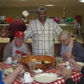 A group of people enjoying a meal together at a restaurant.