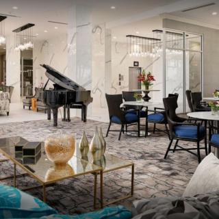 A luxurious living room featuring a grand piano, elegant seating, and modern decor.