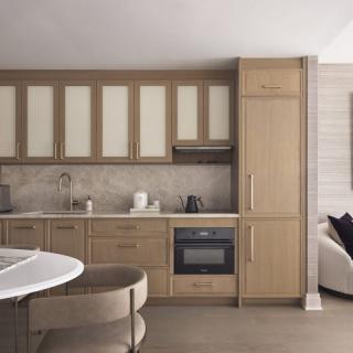 Modern kitchen with wooden cabinetry and minimalist design.