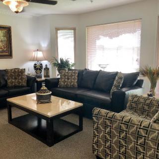 A modern living room featuring comfortable sofas, a stylish coffee table, and elegant decor.