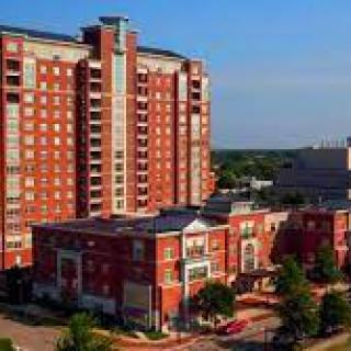A high-rise apartment building in an urban setting.