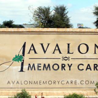 Entrance sign for Avalon Memory Care, a facility specializing in memory care services.