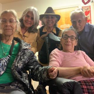 A joyful gathering of friends and family, celebrating together indoors.