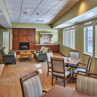 A cozy lounge area with comfortable seating and natural lighting.