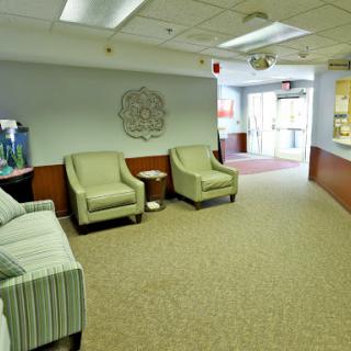 A cozy waiting area featuring comfortable chairs and a welcoming atmosphere.