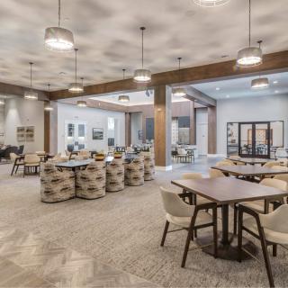 A modern lobby with comfortable seating and stylish lighting fixtures.