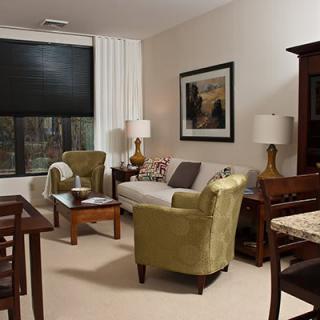 A cozy living room with comfortable seating and warm decor.