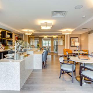 A modern and luxurious open-concept kitchen and dining area.