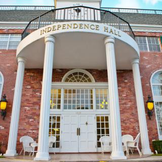 A colonial-style building with a brick facade and prominent columns, labeled 'Independence Hall.'