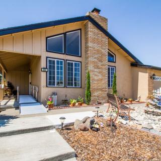 A modern residential home with a landscaped front yard.
