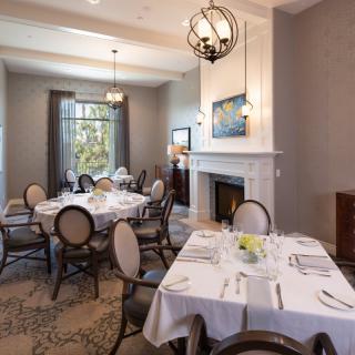 A sophisticated dining room with elegantly set tables and classic decor.