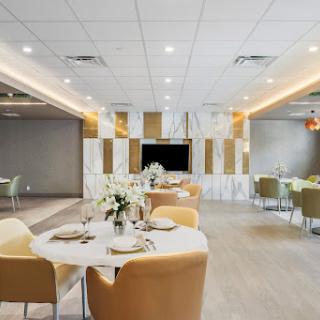 A modern and elegant dining area set for a meal, showcasing stylish decor and contemporary furnishings.