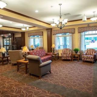 A cozy living area with comfortable seating and warm lighting.