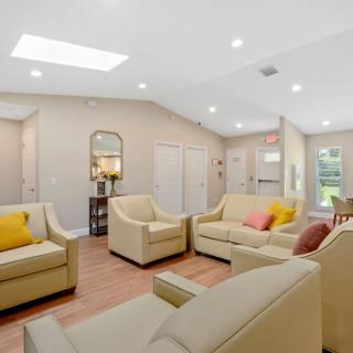 A modern and spacious living room with comfortable seating and contemporary decor.