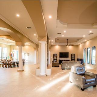 A spacious and modern living room with neutral colors and elegant interior design.