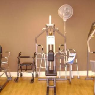 Indoor gym space with exercise machines and fitness equipment.