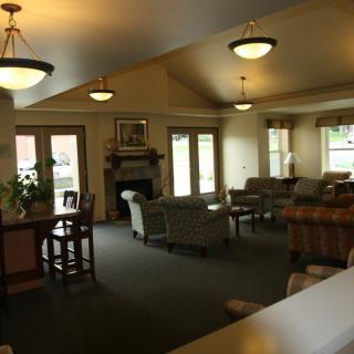 A cozy living room with comfortable seating and soft lighting.
