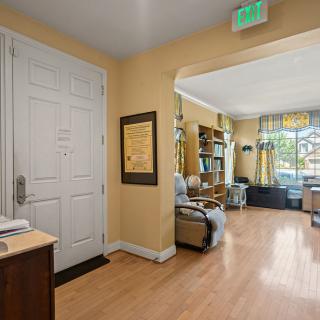A cozy office lobby with seating and decorative elements.