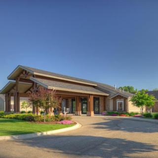 A welcoming residential building surrounded by well-maintained landscaping.