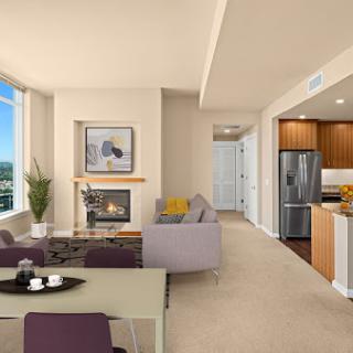 A contemporary living space featuring a cozy atmosphere with modern furniture and an inviting kitchen.