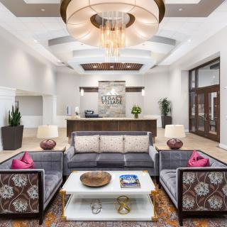 A modern hotel lobby with elegant furnishings and a welcoming reception area.