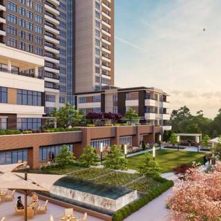 A modern residential complex with landscaped gardens and high-rise buildings.
