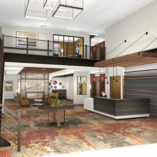 A contemporary lobby featuring a spacious layout with modern furnishings and an inviting reception area.