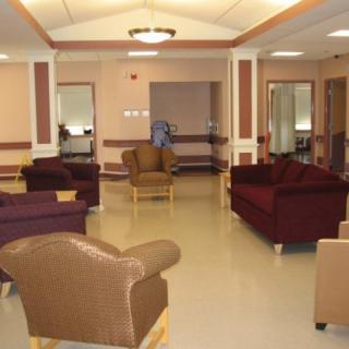 A spacious lobby area with comfortable seating and warm lighting.