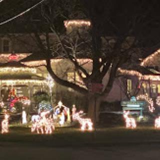 A beautifully decorated house illuminated with Christmas lights and festive displays during the holiday season.
