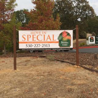 A sign advertising a special offer with a contact number.