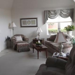 A cozy living room with plush furniture and elegant decor.