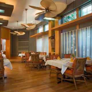 A cozy restaurant interior with neatly arranged tables and stylish decor.
