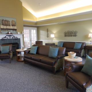 A cozy living room with comfortable sofas and a fireplace.