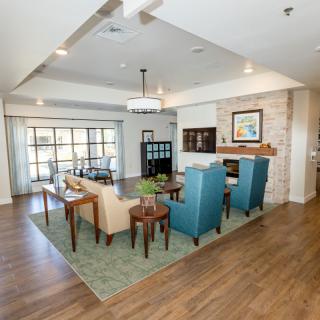A modern living room with comfortable seating, a fireplace, and contemporary decor.